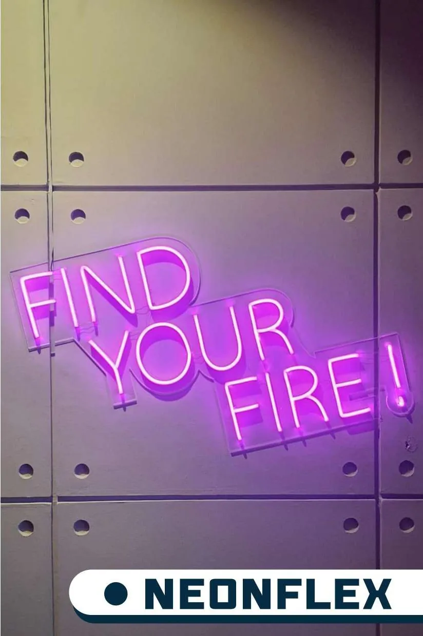 Magenta neon reading Find Your Fire on a wall