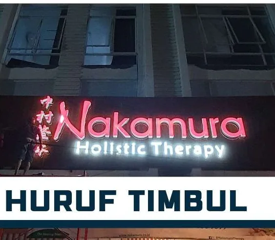 Nakamura Holistic Therapy lit letters on a building